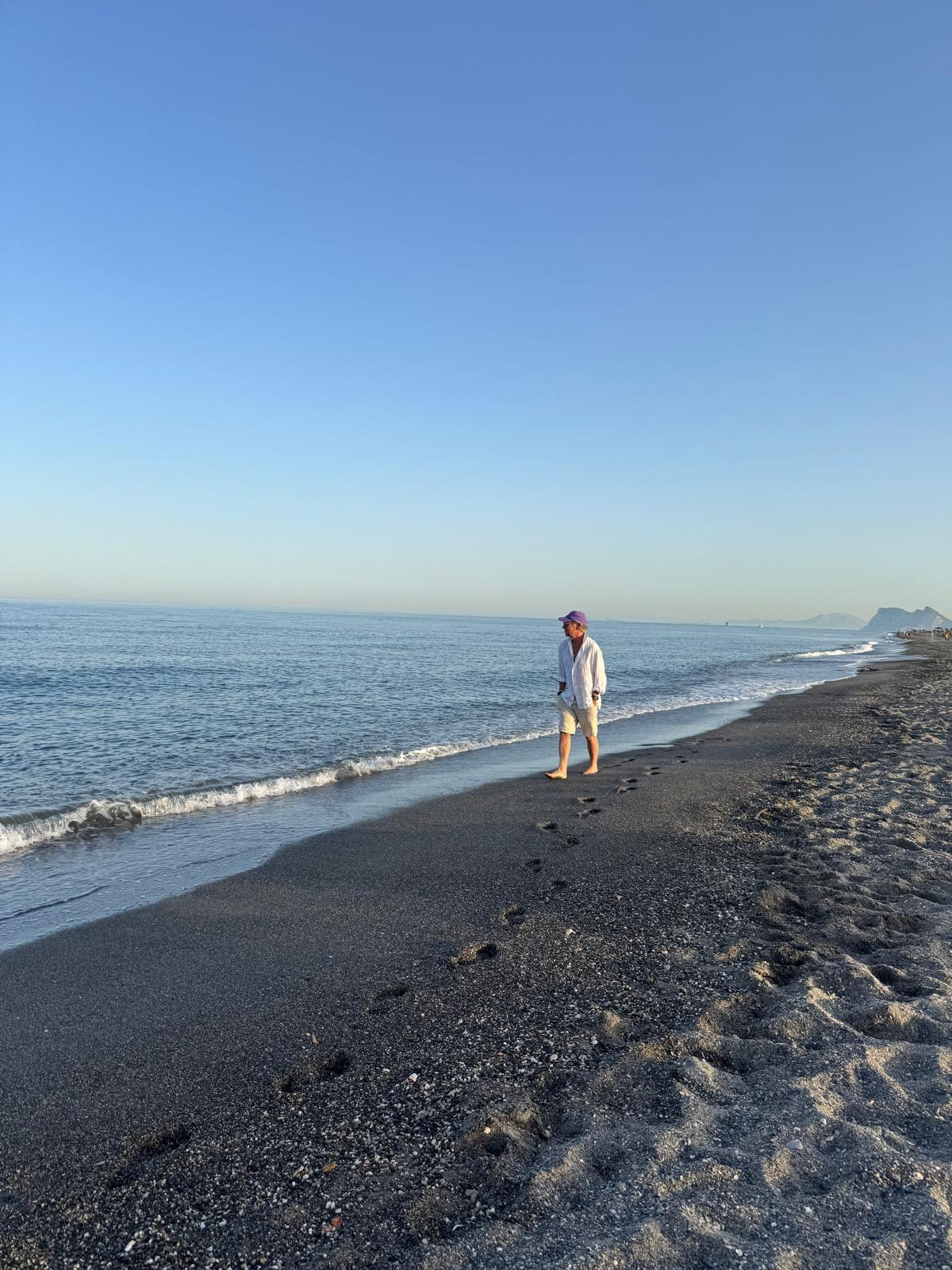 Paul Oberschneider walking on the shoreline at Sotogrande